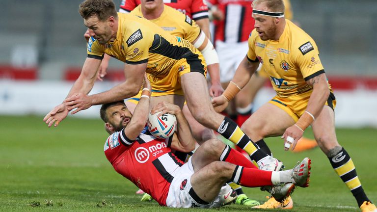 Salford's Elliot Kear runs into some strong Castleford defence