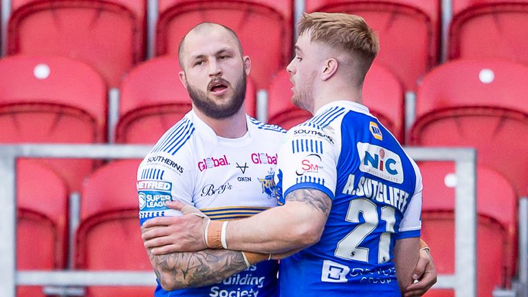 Luke Briscoe celebrates his try for Leeds