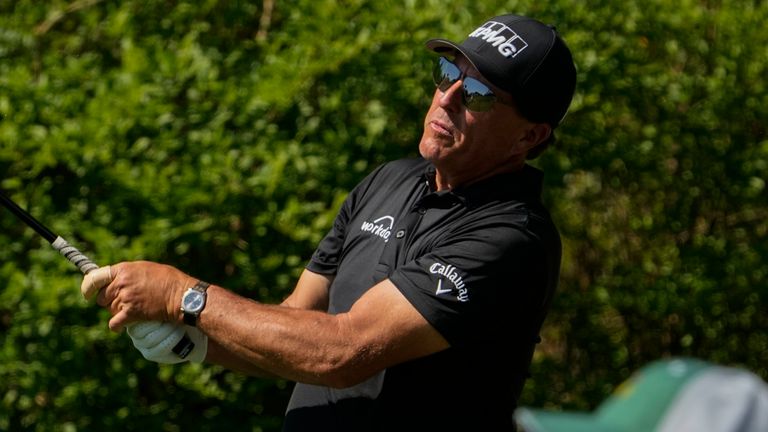 Mickelson watches his tee shot on the 14th hole during his practice round on Tuesday ahead of The Masters 