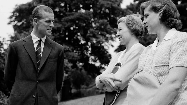 Duke of Edinburgh, Prince Philip (left) talks with US tennis players Louise Brough and Margaret duPont at a pre-Wimbledon garden party in 1949
