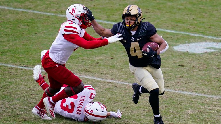 Rondale Moore holds off Nebraska linebacker Will Honas (AP Photo/Michael Conroy)