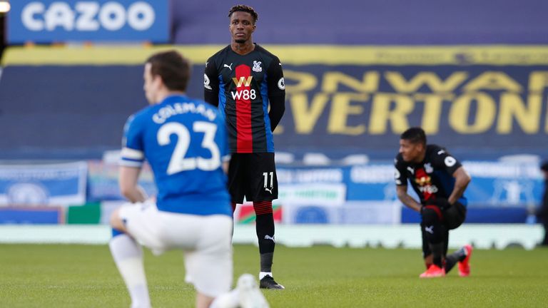 Wilfried Zaha opts against taking a knee ahead of Crystal Palace's Premier League clash with Everton. (Darren Staples/Sportimage via AP Images)  
