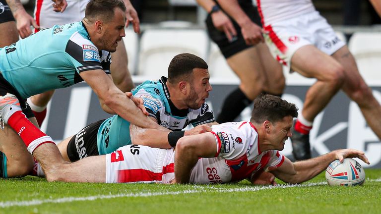 St Helens' Lachlan Coote stretched out to score their second try in the seventh minute 