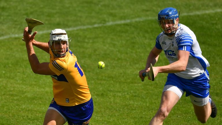 Aron Shanagher of Clare in action against Austin Gleeson of Waterford