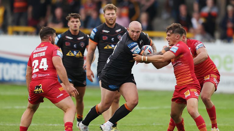 Castleford Tigers' Nathan Massey in action with Catalans Dragons' Arthur Mourgue and Jason Baitieri