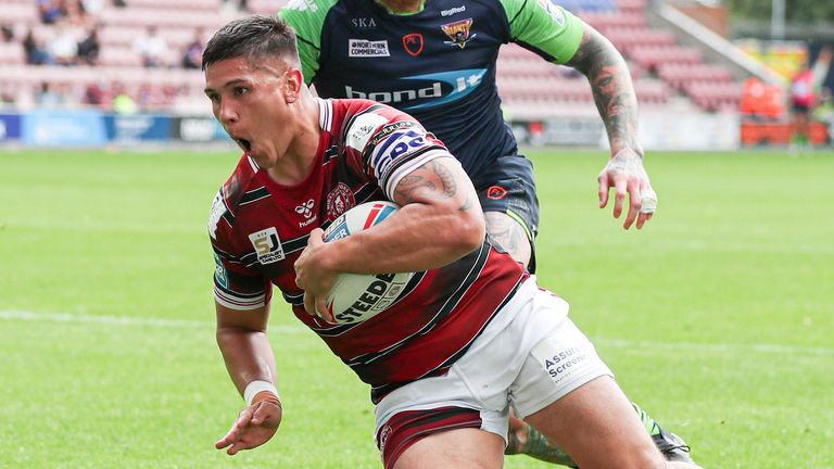 Mitch Clark scored one of three Wigan tries as they came from 12-0 behind to beat Huddersfield 