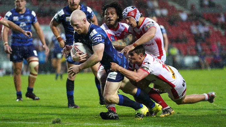 Liam Farrell goes over for Wigan's consolation try