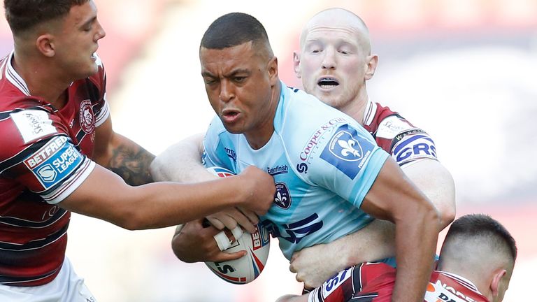 Wakefield's Reece Lyne tries to find a way through the Wigan defence