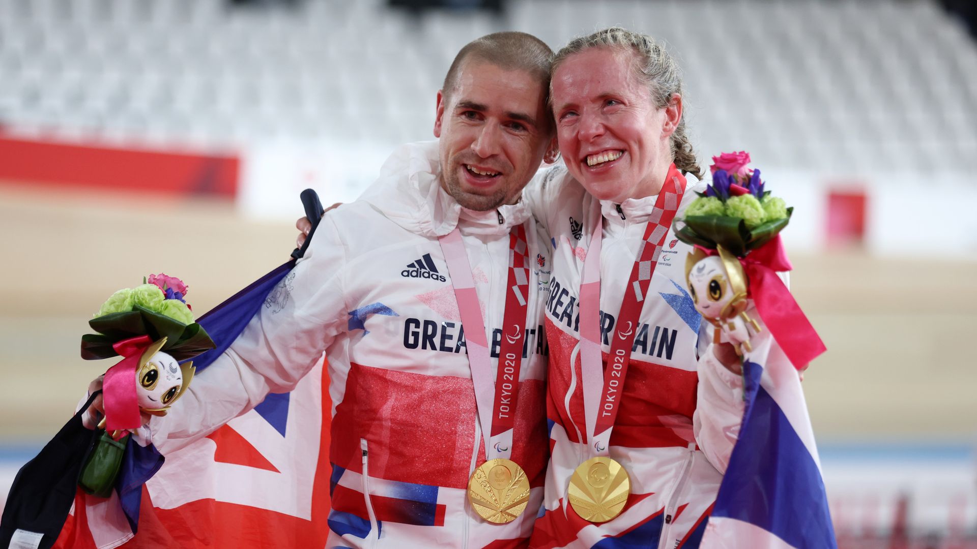 Husband and wife, Neil and Lora Fachie, win golds in world-record times