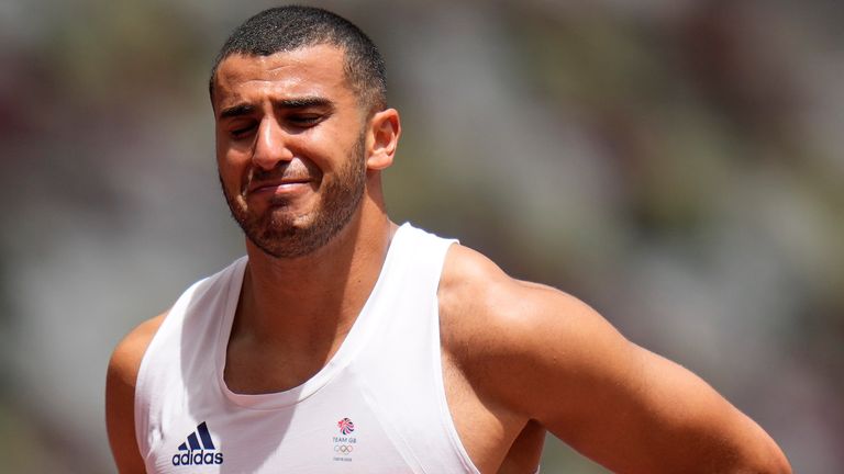Adam Gemili walks from the track following his heat of the men's 200m