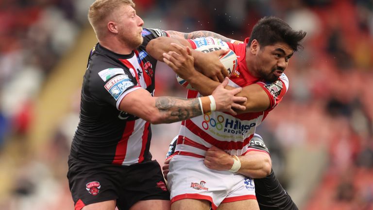 Leigh Centurions' James Bell in action with Salford Red Devils' Danny Addy