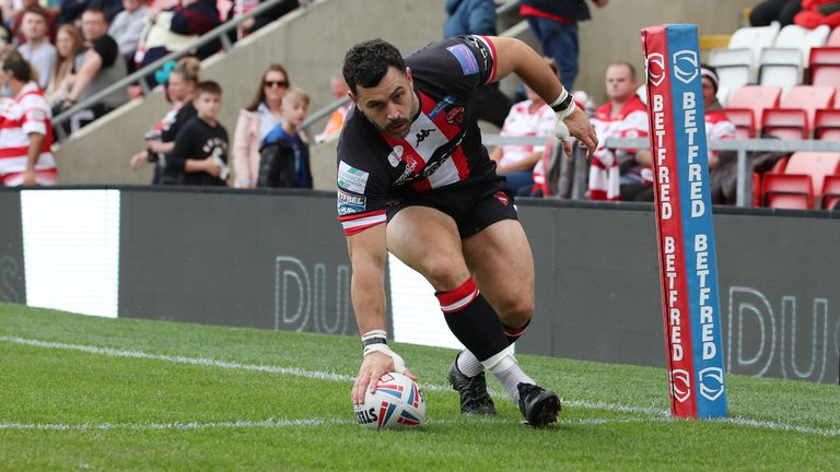 Salford Red Devils' Rhys Williams scores their first try