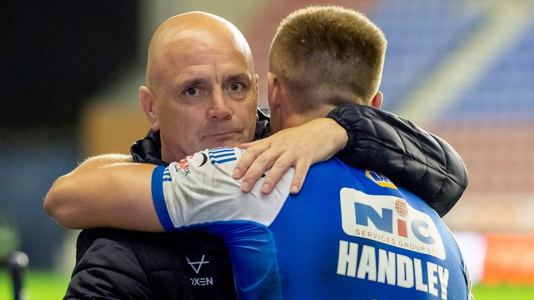 Leeds head coach Richard Agar embraces try-scorer Ash Handley after the play-off win over Wigan