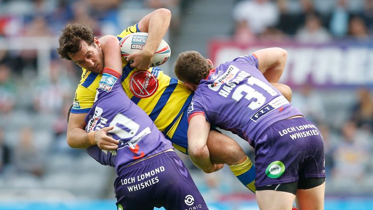 Stefan Ratchford is tackled by Harry Smith and Jackson Hastings