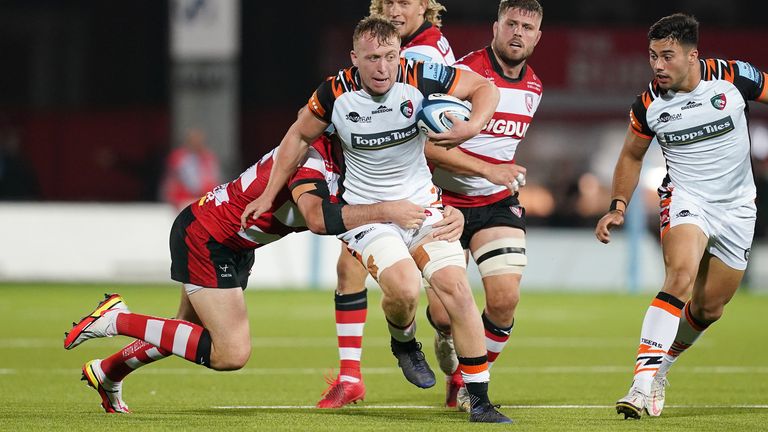 Leicester's Tommy Reffell is tackled by Gloucester's Mark Atkinson