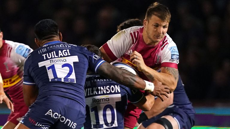 Harlequins' Andre Esterhuizen is tackled by Sale duo Manu Tuilagi and Kieran Wilkinson