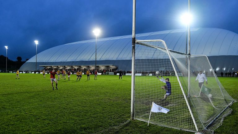 Knockmore goalkeeper Ryan McDonnell saves a penalty to win the match