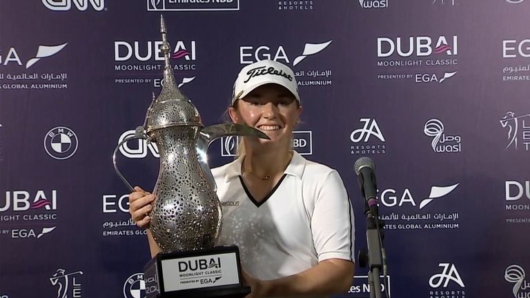 Bronte Low with the trophy after winning the Dubai Moonlight Classic