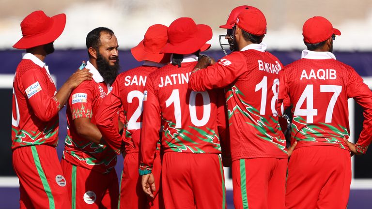 Oman captain Zeshan Maqsood (second left) took three wickets in an over in Muscat
