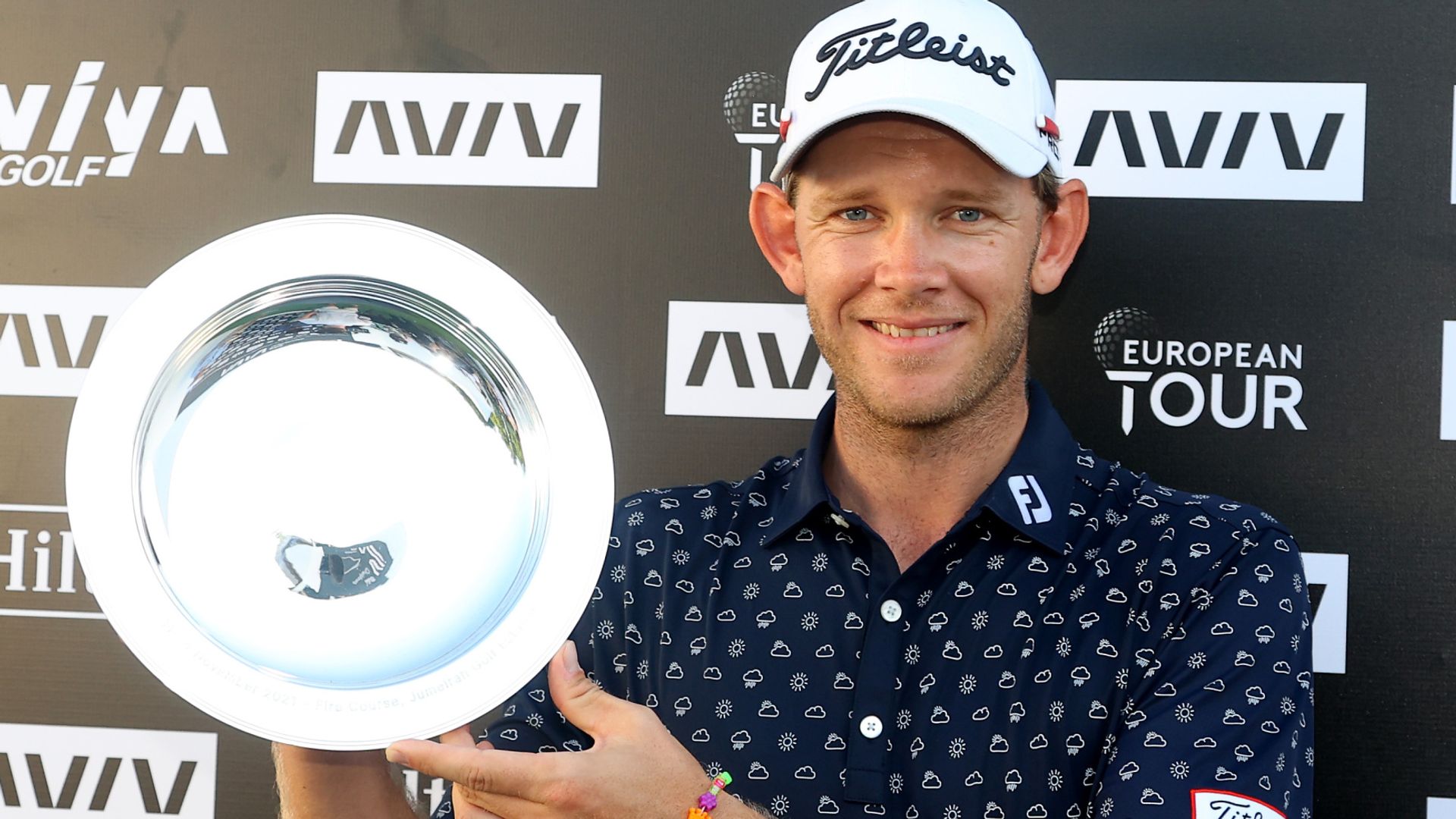 Hansen holds on for Dubai victory