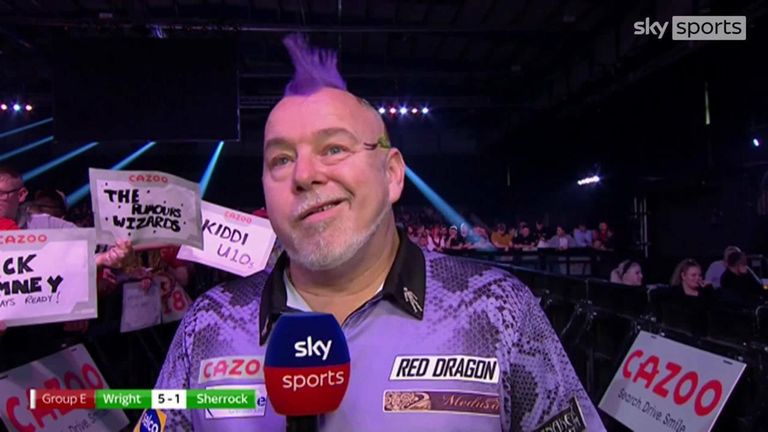 Peter Wright was in a confident mood after seeing off Fallon Sharrock's challenge on the opening night of the Grand Slam