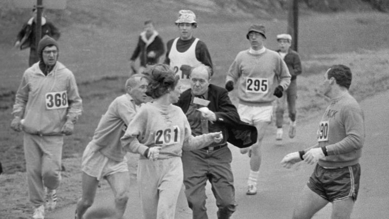 Jock Semple (in street clothes) enters the field of runners to try to pull Switzer (261) out of the race
