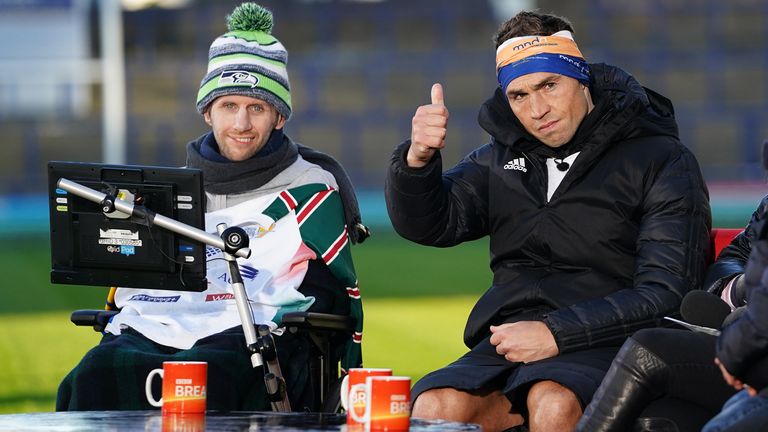 Kevin Sinfield sits with his friend and former team mate Rob Burrow after completing his Extra Mile charity run