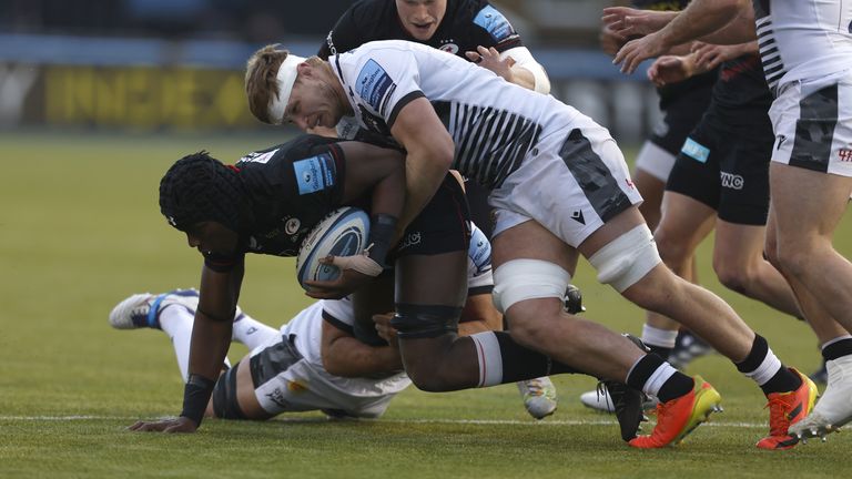 Maro Itoje is tackled by Sale's Akker van der Merwe