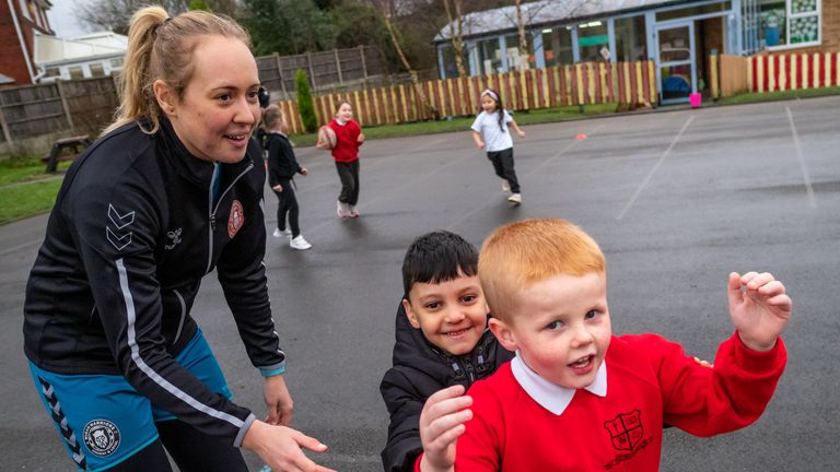 Davies attends a Warriors Unite session at St Benedict's Primary School in Hindley