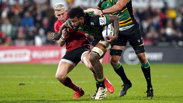 Courtney Lawes runs at the Ulster defence on his return to action for Northampton