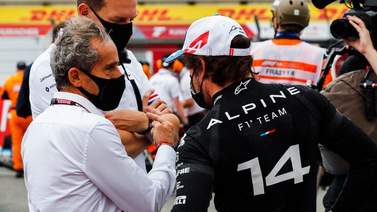 Prost with Alpine driver Fernando Alonso and CEO Laurent Rossi last year