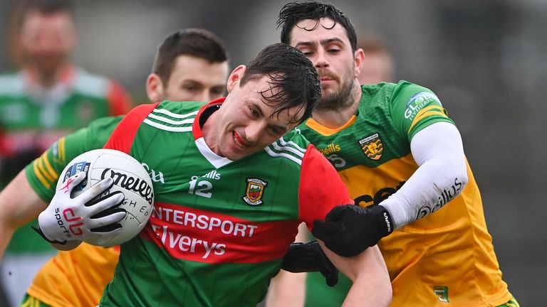 Diarmuid O'Connor of Mayo is tackled by Ryan McHugh of Donegal