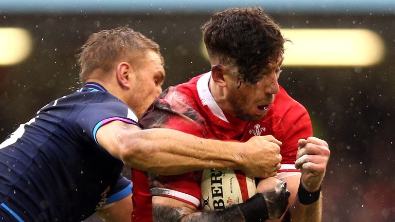 Wales' Alex Cuthbert is tackled by Chris Harris