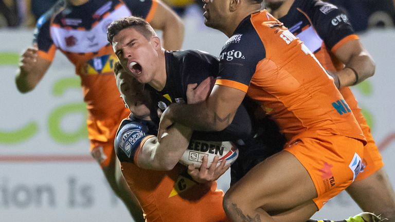 Salford's Brodie Croft is tackled by the Castleford defence