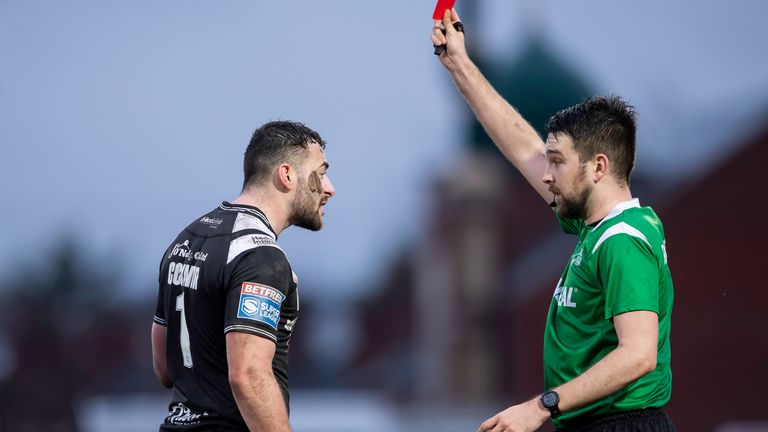 Jake Connor is shown the red card by referee Marcus Griffiths for a dangerous tackle