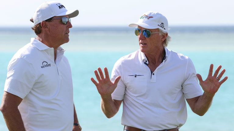Phil Mickelson (left), pictured here speaking with Greg Norman, is a potential participant in the new Saudi-backed series.