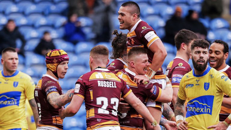 The Giants players celebrate Luke Yates' try