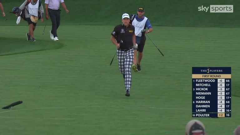 Ian Poulter was determined to finish his round before the light failed and raced around the seventeenth at TPC Sawgrass.