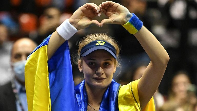 Dayana Yastremska celebrated her win with a Ukrainian flag draped over shoulders