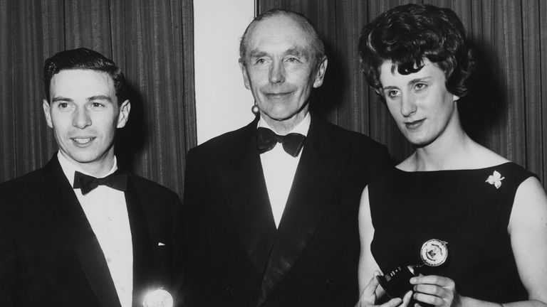 British Prime Minister Alec Douglas-Home with Sportswoman of the Year Dorothy Hyman and Sportsman of the Year Jim Clark at the annual dinner of the Sport Writers' Association in December, 1963