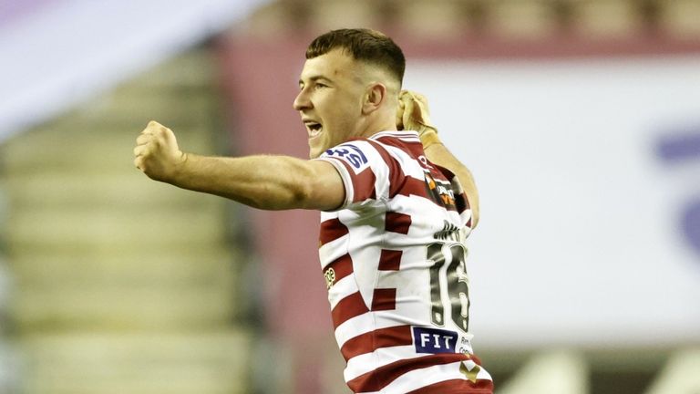 Harry Smith celebrates kicking the game-winning drop goal for Wigan