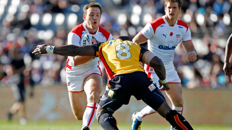 James Roby takes a tackle during the Four Nations, with Sean O'Loughlin backing up the England hooker