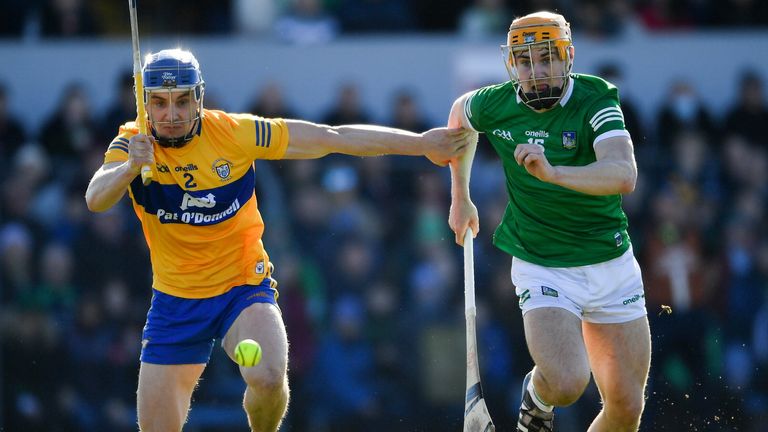 Adam English of Limerick is tackled by Clare's Rory Hayes