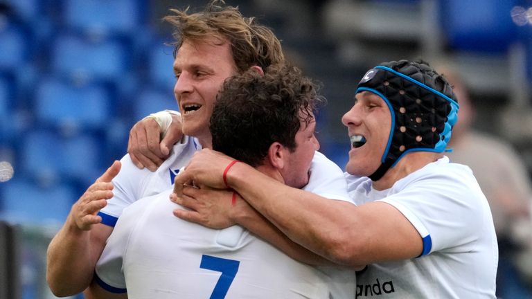 Italy celebrate Callum Braley's try (first from left) which got them back into things in the first half