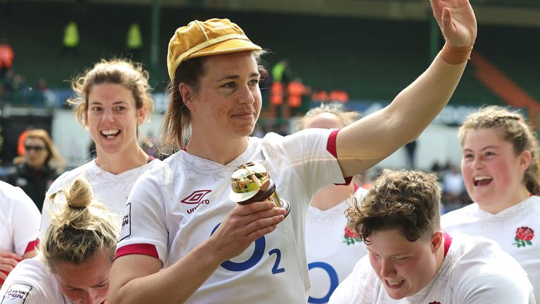 Emily Scarratt celebrates winning her 100th international cap for England in the Six Nations game against Ireland