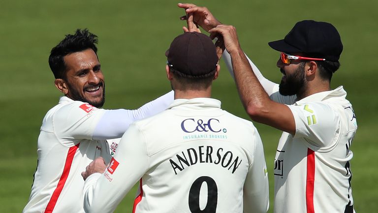 Pakistan's Hassan Ali celebrates a wicket with England pair James Anderson and Saqib Mahmood as Lancashire secured a tense final-day win over Gloucestershire