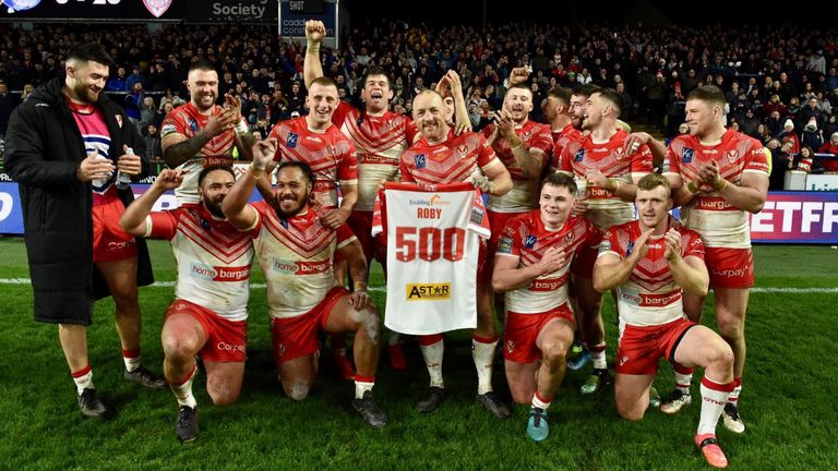 James Roby celebrates with his St Helens team-mates and fans after his 500th appearance for the club
