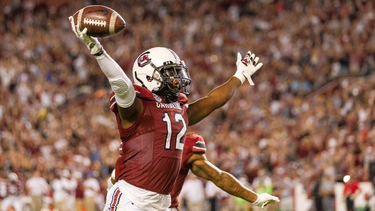 Jaylan Foster (12) celebrates his interception in the second quarter against the Kentucky Wildcats