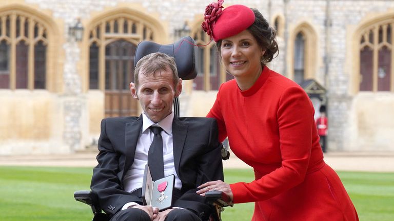 Rob Burrow receives his MBE at Windsor Castle with his wife Lindsey