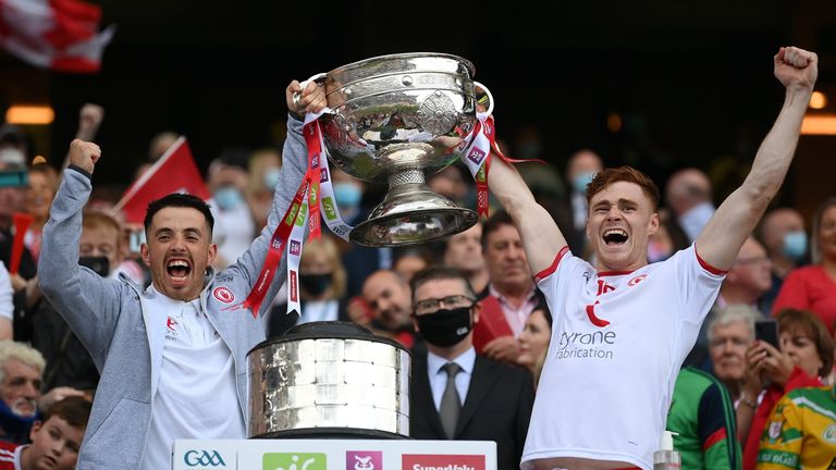 Ronan O'Neill lifts the Sam Maguire Cup with club mate Conor Meyler